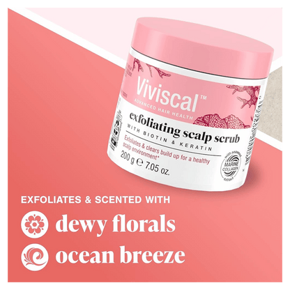 Viviscal exfoliating scalp scrub jar with pink lid on a pink background